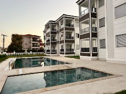 exklusive 1+1 wohnung mit pool, gehabstand zum zentrum von dalaman